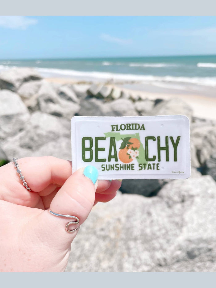 Waterproof Beachy Florida license plate sticker lifestyle shot by ocean