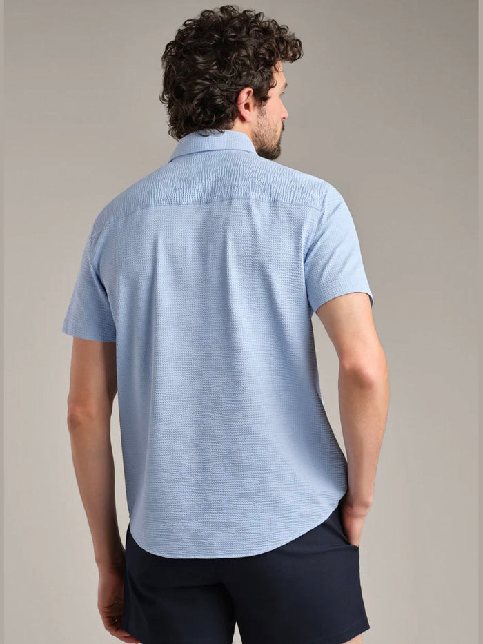 Back view of tailored light blue seersucker button down shirt